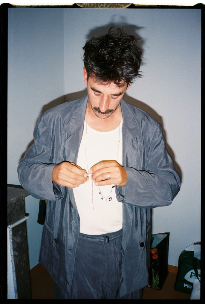 Groom getting ready on film